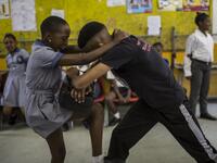 Girls practice self defence methods during a session with NGO Action Breaks Silence (ABS) called "Empowerment through self-defence for women and girls". (GULSHAN KHAN / AFP)