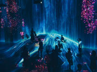 Visitors enjoying the ‘rain’ in one of the spaces within the teamLab permanent exhibition in Mori Digital Art Museum. Picture taken in Tokyo, Japan on 14 July 2018. (Shutterstock/ File)
