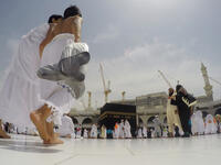 Two brothers among thousands of pilgrims perform the Tawaf. Tawaf around the Kaaba of 7 times (Shutterstock/File Photo)