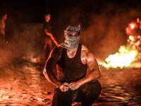 A Palestinian protester from a group calling themselves the "night confusion units"  (Twitter)