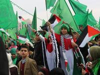 Palestinians attend a rally marking the 31st anniversary of Hamas' founding. (Twitter)