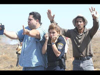 palestinian men protect israeli policewoman