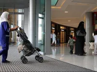 nanny maid child airport scene Arabs