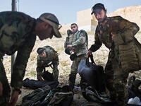 The Lebanese Armed Forces gather their gear before heading to the next event in the Warrior Competition. Different teams from Lebanon competed, including the Black Panthers, part of the Lebanese intelligence service.
