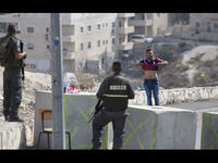 israeli checkpoint with palestinian man