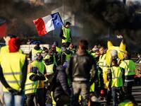 People block Caen's circular road on November 18, 2018 in Caen, Normandy, on a second day of action, a day after a nationwide popular initiated day of protest called "yellow vest" movement. 
CHARLY TRIBALLEAU / AFP