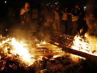 People block the Caen's circular road on November 18, 2018 in Caen, northwestern France, on a second day of action after a nationwide popular initiated day of protest called "yellow vest"  against fuel prices.
CHARLY TRIBALLEAU / AFP