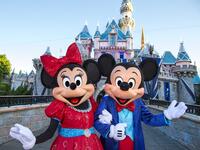 Mickey Mouse and Minnie Mouse look dazzling in their sparkling, new costumes, created especially for the Diamond Celebration at the Disneyland Resort. (disneyexaminer.com)