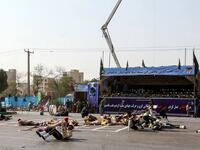 This picture taken on September 22, 2018 in the southwestern Iranian city of Ahvaz shows injured soldiers lying on the ground at the scene of an attack on a military parade. (Alireza MOHAMMADI / ISNA / AFP)