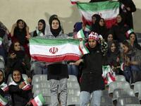 Iranian women cheer during the friendly football match between Iran and Bolivia at the Azadi Stadium in Tehran on October 16, 2018. (STR / AFP)

