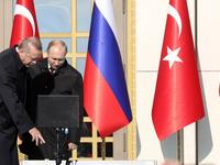 Turkish President Erdogan (L) and Putin attend a ground-breaking ceremony of Turkey's first nuclear power station at the Presidential Palace in Ankara on April 3, 2018.  Putin arrived for a Turkey visit also to coordinate policy on Syria. (AFP File Photo)
