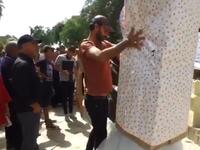 A huge gift-wrapped box with read “Gift of the Rapist”.
Baghdad's Woman Association 