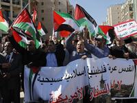 Arab demonstrators protest in front the new United States embassy in Jerusalem on May 14, 2018. The banner reads in Arabic " Jerusalem is Arab, Palestinian, Moslem, Christian". AHMAD GHARABLI / AFP