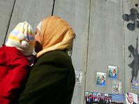 Flying Balloons Girl by Banksy, drawn on the security barrier in Bethlehem /AFP