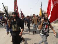 Armed Iraqi civilians attend the funeral of a man on September 4, 2018, that family and Human rights activists claim was killed by bullet shots during the previous day, while demonstrating against the government and the lack of basic services, in the southern city of Basra.
Haidar MOHAMMED ALI / AFP