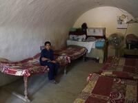 A young Pakistani villager sits in a cave room in Nikko village, about 60 kilometres from the capital Islamabad.
AAMIR QURESHI / AFP
