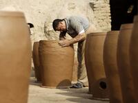 Iraqis making clay pots in Najaf on November 11, 2018. Pottery has deep roots in Iraq, where ancient civilisations turned to clay to build their homes, shape their cooking utensils, and even make their ovens.
Haidar HAMDANI / AFP