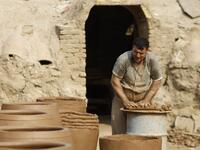 Iraqis making clay pots in Najaf on November 11, 2018. Pottery has deep roots in Iraq, where ancient civilisations turned to clay to build their homes, shape their cooking utensils, and even make their ovens.
Haidar HAMDANI / AFP