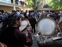 Iraqi Sufi Muslim Kurds take part in a ritual ceremony to commemorate the birth of the Prophet Mohammed in the Kurdish town of Akra. 
SAFIN HAMED / AFP