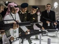 A visitor aims a weapon at the Saudi stand during Egypt’s first Service Defence Exhibition in Cairo on December 3, 2018, at the International Exhibition Center. 
Khaled DESOUKI / AFP