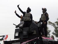 Members of the Iraqi security forces take part in celebrations marking the first anniversary of the country's victory over the Islamic State (IS) group.
Zaid AL-OBEIDI / AFP