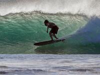 A surfer enjoys the waves at Las Baulas National Marine Park, Playa Grande, Costa Rica on December 10, 2018. David GANNON / AFP