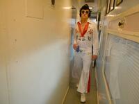 An Elvis fan walks through a train after leaving Central station to head to The Parkes Elvis Festival, in Sydney on January 10, 2019.
SAEED KHAN / AFP