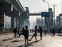 People play football on a street in Addis Ababa on February 3, 2019 during the third Car Free Day promoted by local NGOs and the Ethiopian Government to appeal a healthy life style and a less air pollution of the capital city. 
EDUARDO SOTERAS / AFP