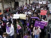 Lebanese demonstrators hold placards as they participate in a march against marriage before the age of 18 in the capital Beirut, on March 2, 2019. 
ANWAR AMRO / AFP