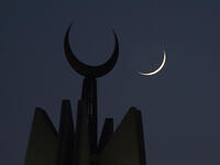 The new crescent moon of Ramadan rises over the Faisal Mosque in Islamabad, Pakistan.
 Farooq Naeem/AFP