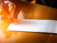 Cheque comes from the Arabic saqq, a written vow to pay for goods when they were delivered. (Shutterstock/ File Photo)