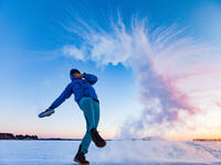 A hiker throws a bottle full of boiling water in the air. Rapid freezing happens when the temperature difference is big enough. (Shutterstock/ File Photo)