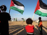 Everyone joins in the fun. Young and old watch. April 10, 2018. SAID KHATIB / AFP