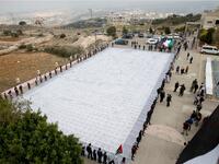 Arial photo of largest Keffiyeh with a size of one thousand four hundred Meter square in dura, near the West Bank town of Hebron, on November 14. (HAZEM BADER / AFP)