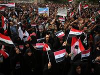 Men and women protestors in Baghdad’s Tahir Region on April 15, 2017 combine a show of unity against western military strikes on Syria for the alleged chemical attacks on Douma, AHMAD AL-RUBAYE / AFP