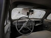 The interior of the 1947 Plymouth parked outside the home of Mohammed Mohiedin Anis, or Abu Omar in Aleppo's formerly rebel-held al-Shaar neighborhood. Once a wealthy man, he owned around 30 classic cars, mostly vintage American cars from the 1940s and 1950s. 