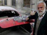 70-year-old Mohammed Anis opens the trunk of his 1949 Hudson Commodor outside his home in Aleppo. Most of his cars have either been damaged by shelling in the war or stolen by fighters. He left Aleppo just two months before the eastern part of the city fell to government forces, but later returned, vowing to restore his “wounded” cars. 