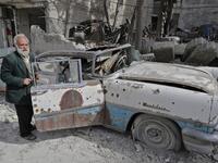 Mohammed inspects his 1957 Mercury Montclair outside his home in Aleppo. When asked “how can you live here?” he replied simply, “this is my home.”
