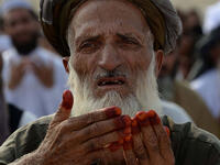 An Afghan resident offers prayers at the start of the Eid el-Fitr holiday at open air mosque on the outskirts of Jalalabad on June 25, 2017. Afghanistan has witnessed the deadliest Ramadan since 2001, with 200 people killed and hundreds wounded. This year, many people have avoided large public gatherings out of fears for further attacks.