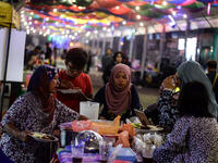 Malaysian Muslims break their fast on the first day of the Islamic holy month in Kuala Lumpur. During the night, markets offer a rich variety of different drinks including the bandung drink, made of milk with rose syrup or soybean milk mixed with grass jelly. For those, who cannot afford an Iftar meal, mosques offer a local rice porridge for free. 
