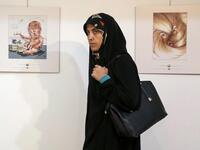 Another Iranian entry on the right, bringing attention to the president's golden locks. (AFP) 