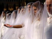 Scrapping laws that protect rapists: Activists from the Lebanese NGO Abaad (Dimensions), a resource center for gender equality, dressed as brides and wearing bandages hold a protest in downtown Beirut on December 6, 2016, against article 522 in the Lebanese penal code. 