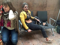 Bombings strike Brussels: Nidhi Chaphekar, a flight attendant, sits injured and in shock in the aftermath of the bombing at Brussels Airport. The three bombings, claimed by Daesh, killed 32 and injured more than 300.