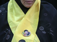 A Lebanese woman wears a scarf with the Hezbollah flag colours as she attends a gathering for a televised speech held by the Shiite party in the capital Beirut, commemorating the party's killed leaders, on February 16, 2018. 
(JOSEPH EID / AFP)