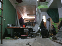 Syrian civilians take shelter during government bombing in the rebel-held town of Hamouria, in the besieged Eastern Ghouta region on the outskirts of the capital Damascus, on Feb. 19, 2018. 
(ABDULMONAM EASSA / AFP)
