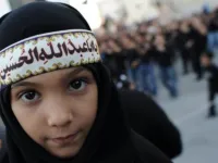 Ashura derives from 'tenth': It is a holy day for Islam marked on the 10th of 'Muharram', the first month of the Islamic lunar 
calendar. Muharram represents a period of mourning for a historical grievance in Shia Islam,
culminating Ashura. This child displays a classic lament for the revered martyr: 'O Hussein you were the father of Abdullah'.