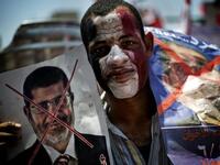 He'd probably paint that X right across Morsi's face if he had the chance (AFP)