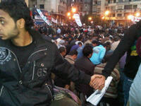 All Egyptians rally round each other: Coptic Christian Egyptians protecting the Muslim Egyptians during prayer.