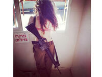 Luckily for this mysterious brunette, her massive gun gives her a little modesty.