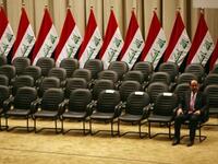 Iraqi Prime Minister Nuri al-Maliki waits for the members of his new cabinet to arrive during a parliamentary session in Baghdad in which lawmakers unanimously approved the new government which will be headed by the incumbent Shiite premier.